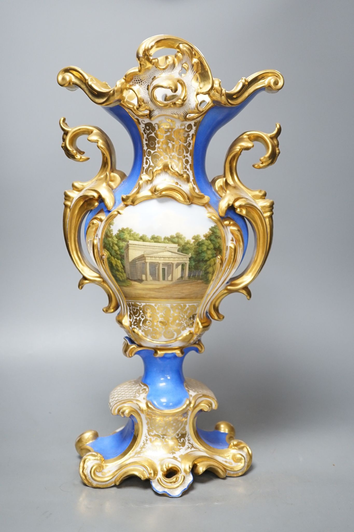 An early 19th century Paris porcelain vase in Feuillet style painted with a folly 44cm
